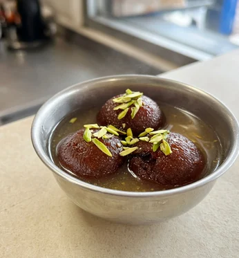 Gulab jamun in syrup with pistachio