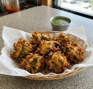 Mixed vegetable pakoda with green chutney